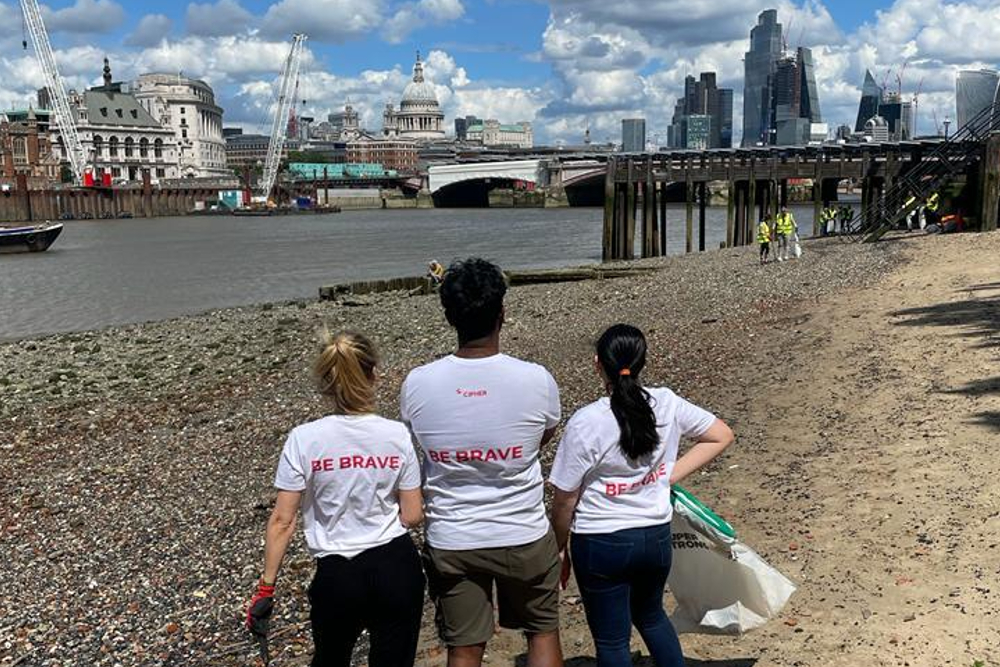 The Cipher team by the River Thames in June 2022 for a beach clean